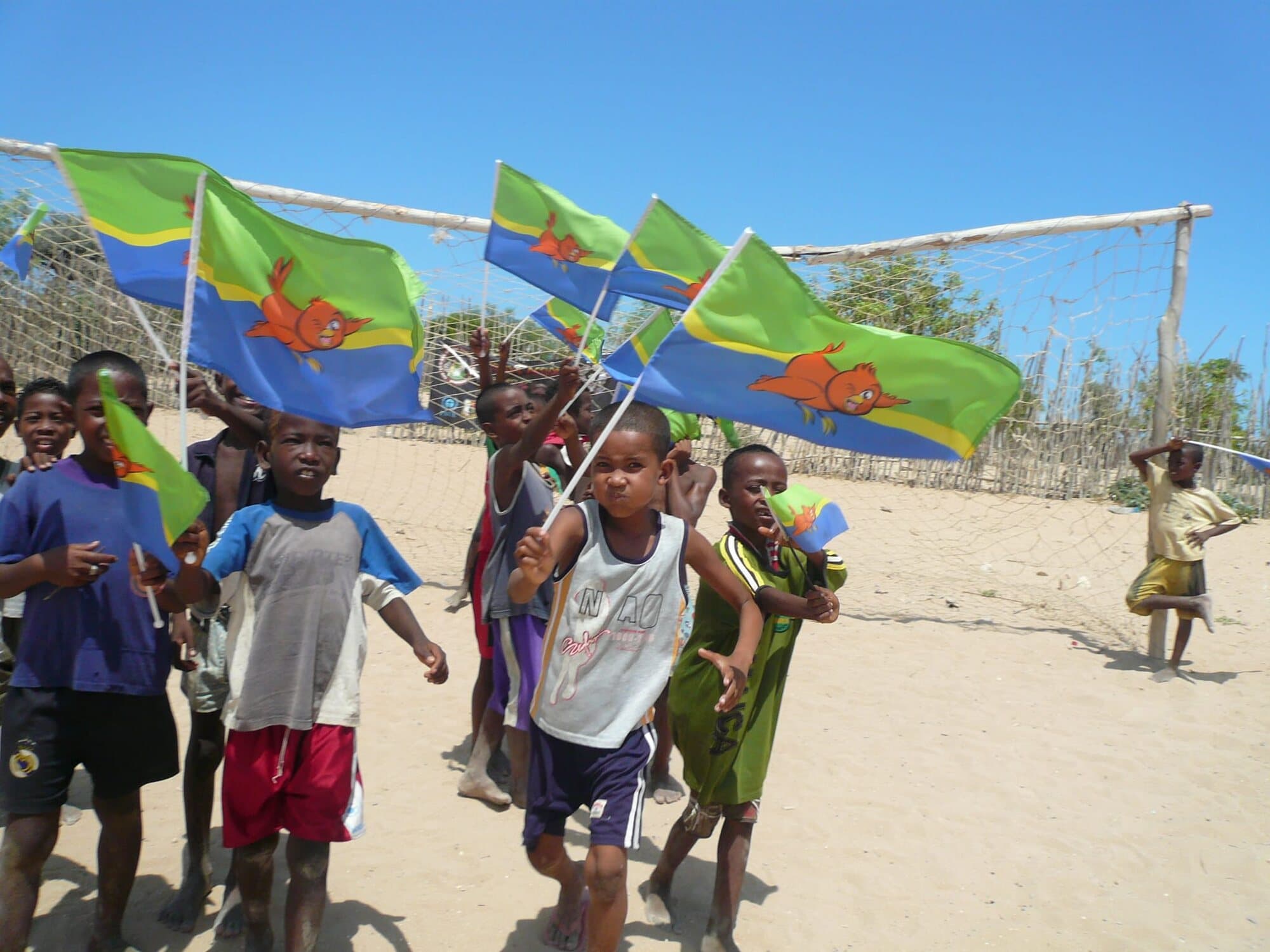 Children around the world waving Boopy flags